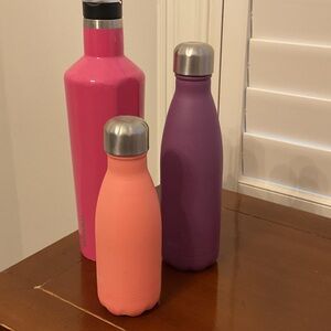 Swell and Corkcicle Water Bottles Vibrant Colors Pink, purple and peach